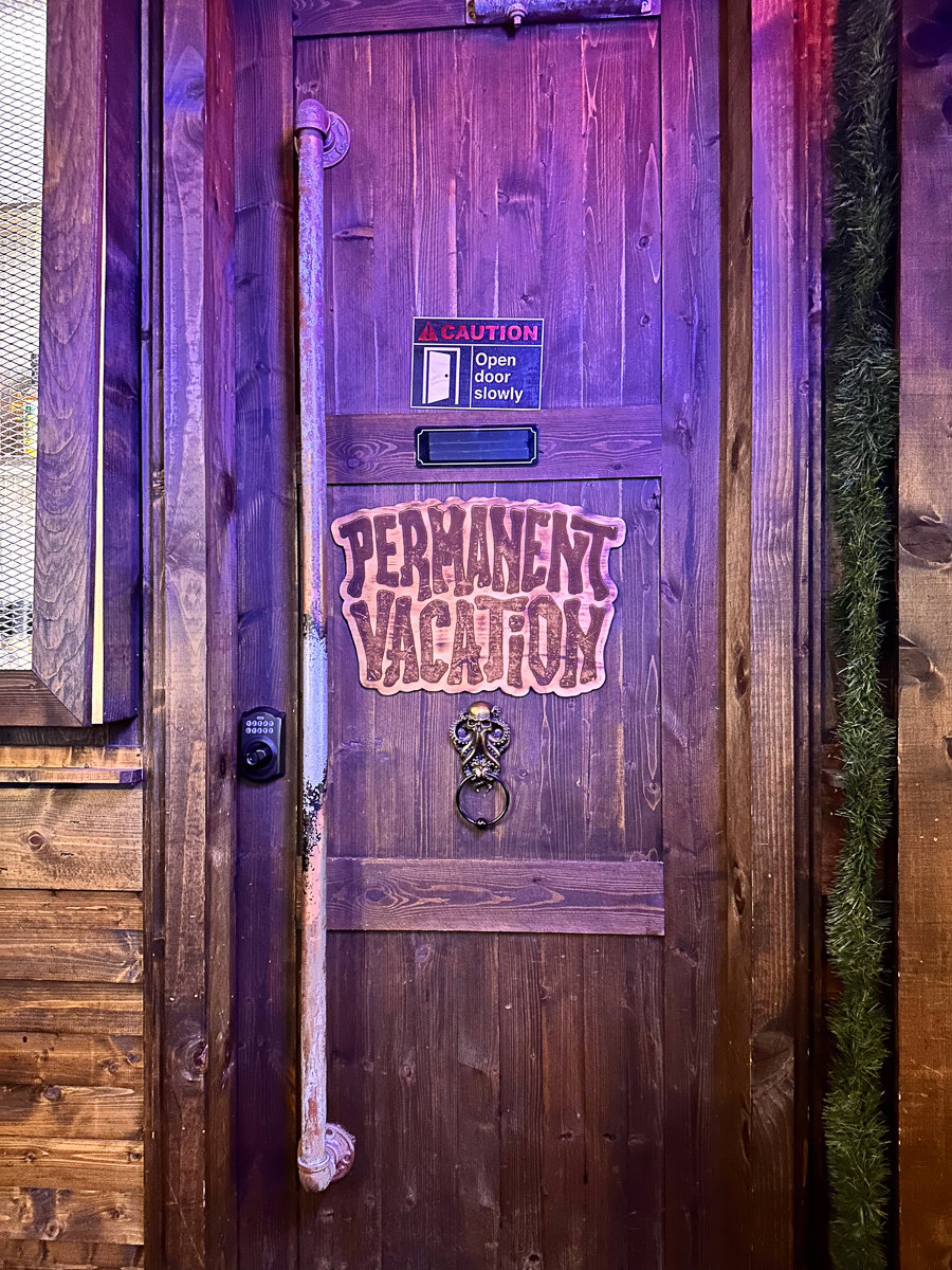 door with permanent vacation sign
